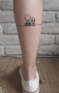 a person with a small tattoo on their leg