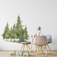 a room with some chairs and trees on the wall behind it, in front of a white wall