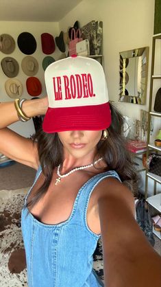 Lets head to "Le Rodeo!" Whether you're headed to a country concert, an actual rodeo, or running errands, this is the perfect hat to add a pop of color to your outfit! So cute styled with a white tee and denim! Collab with Caleigh Hardy! Twill cap Made in USA Embroidery at front and side panel Adjustable back strap Brim measures approx 3" in lengthOS measures approx 23.55" in circumference Retro White Hat For Rodeo, Red Spring Rodeo Hat, Red Hats For Rodeo Spring Season, Red Hats For Rodeo In Spring, Red Hat For Rodeo Spring Season, Retro Summer Trucker Hat For Rodeo, Red Snapback Hat For Rodeo, Red Snapback Trucker Hat For Rodeo, Red Trucker Hat For Rodeo