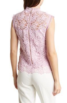 Intricate lace adds a touch of elegance to a mock-neck top with a tonal lining for sweet styling. 23" length (size Small) Mock neck Sleeveless Lined 100% polyester Hand wash, dry flat Imported Elegant Sleeveless Lace Top With Collar, Spring Sleeveless Scallop Lace Top, Spring Scallop Lace Sleeveless Top, Chic Sleeveless Lace Top With Lace Trim, Fitted Scalloped Lace Sleeveless Top, Chic Sleeveless Tops With Delicate Lace, Chic Sleeveless Lace Trim Top, Chic Sleeveless Top With Lace Collar, Feminine Sleeveless Scalloped Lace Top