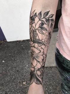 a person with a flower tattoo on their arm