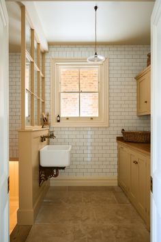 a bathroom with a sink and window in it