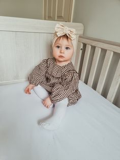 This pretty 'Boho' styled two-piece set consists of a delightful smock top with ruffled yoke, full-length balloon sleeves, a round neck and button back fastening. The bloomer-style pants have an elasticated waist and legs. It is made in a high quality medium-weight Cotton Gingham. Available in 6-12 months and 12-18 months. Machine washable. If you would like to see our Cake Smash or First Birthday Outfits, click here to browse - https://www.etsy.com/your/shops/PeachPearDesigns/tools/listings/section:33079092,stats:true If you would like to buy one of our gorgeous triple knot turbans , you can browse all the colours here - https://www.etsy.com/your/shops/PeachPearDesigns/tools/listings/section:32402214,stats:true  PLEASE NOTE If you are ordering from outside of the UK, particularly from the 3 Month Old Girl Outfits, Baby Girl Style Outfits, Baby Girl Winter Outfits, Baby Outfits Girl, Baby Girl Style, Outfit Baby Girl, Family Photoshoot Outfits, Old Outfits, Baby Girl Outfit