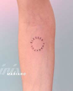 a woman's leg with the word blessing written on it in small black ink