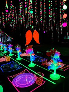 glow in the dark party tables with plates and place settings