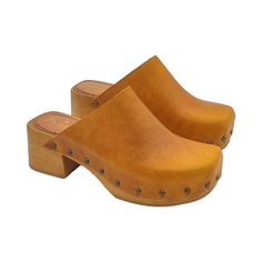 Express your unique style with our handmade clogs, made with top quality materials to allow you to have maximum comfort at an affordable price. Brown wood effect base Upper in ochre leather Rounded closed tip Padded insole in leather  6 cm heel height and 3 cm platform Stable and comfortable made entirely in Italy.  Craftsmanship. Before completing the purchase, do not forget to check the size! --- This handmade article is made and designed entirely by the artisan Gennaro Duello founder of Kiara Wooden Clogs With Stacked Heel And Round Toe, Brown Wooden Clogs With Wooden Heel, Wooden Closed Toe Clogs With Stacked Heel, Wooden Clogs With Stacked Heel And Closed Toe, Brown Wooden Heel Clogs, Yellow Leather Closed Toe Mules, Natural Leather Mules With Wooden Heel, Leather Mules With Wooden Heel In Natural Color, Yellow Casual Clogs With Wooden Heel