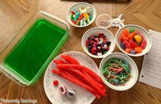 several bowls with candy in them on a table