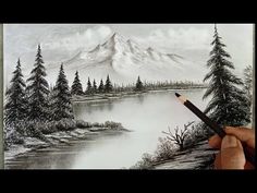 someone is drawing a landscape with pencils