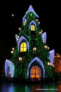 a house covered in christmas lights at night