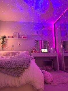 a bedroom with purple lighting and stars on the ceiling