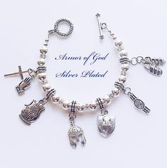 "Place your order today, to have it in time for Christmas!!  The receiver will love it!! Beautifully handrafted \"Armor of God \" bracelet with Antique Silver Charms. The charms features:  Helmet of Salvation, Breastplate of Righteousness,  Belt of Truth,  Shoes of Peace, Shield of Faith and the Sword of the Spirit. Biblical Scriptures found in Ephesians 6:10-1, explains what the Full Armor of God is. Protection from God! Standard size is 7 1/2 inches long. Please indicate in a message if you need a different size. Leave me a note to let me know which box you would like." Symbolic Silver Rosary Bracelet Gift, Symbolic Silver Rosary Bracelet, Symbolic Silver Rosary Bracelet For Gifts, Silver Symbolic Rosary Bracelet As Gift, Engraved Silver Rosary Bracelet As Gift, Silver Rosary Bracelet With Charms As Gift, Spiritual Silver Bracelet Gift, Silver Spiritual Bracelets, Spiritual Silver Charm Bracelet For Mother's Day