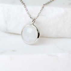 Dainty Moonstone necklace for women in 14K solid gold. A dainty gold birthstone necklace ideal for birthday gift or for Christmas. Genuine rainbow moonstone pendant on 14K solid gold chain with a spring clasp. Moonstone is also June birthstone.  100% handcrafted with love! D E T A I L S● Metal: 14K solid gold, 14K white gold or 14K rose gold● Gemstone: Moonstone, round briolette cut ● Stone Diameter: 10mm (0.4in)● Length: 39cm (15.5in) to 47cm (18.5)H O W ∙ T O ∙ O R D E RChoose from the drop do Minimalist May Birthstone Charm Necklace, Dainty Moonstone Charm Necklace For Gift, White Gold Moonstone Necklace For Gift, Minimalist White Charm Necklace For Anniversary, White Gemstone Necklace For May Birthstone, Moonstone Round Necklace For Anniversary, Minimalist White Pendant Birthstone Necklace, Minimalist White Birthstone Necklace With Delicate Chain, White Birthstone Round Pendant Necklace