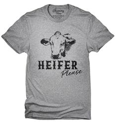 a gray shirt that says heifer please with a cow's head on it