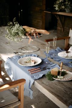 the table is set with plates and silverware