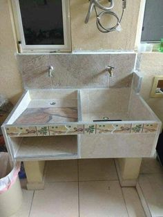 a bathroom vanity with two sinks and mirrors