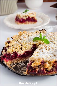 a piece of pie is sitting on a plate next to the rest of the pie