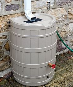 a water heater sitting next to a stone wall