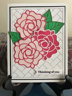 a card with flowers on it and the words thinking of you