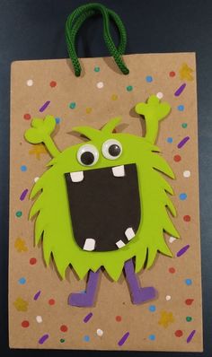 a paper bag with an image of a green monster on it's face and arms