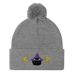 This Halloweenie beanie features a cute embroidered black cat witch surrounded by crescent moons and stars. Finished with a pom-pom on top, it offers tons of warmth and comfort, and is destined to find its way into all your favourite cold-weather looks.• 100% acrylic• 12″ (30.5 cm) knit• Pom-pom on top• One size fits mostSize Guide• Circumference: 45-48 cm• Height: 23.5 cm• Diameter: 20.8 cm• Cuff: 7.6 cm* This item is made-to-order and ships separately from ready-to-ship items in the shopBecaus Black Cat Witch, Moons And Stars, Needle Felting Kits, Halloween Fall, Pom Beanie, Grey And Gold, Winter Hat, Needle Felting, Black And Navy