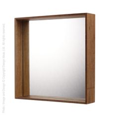 a wooden frame mirror mounted on the wall with a white back ground and light brown trim