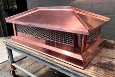 a large metal object sitting on top of a wooden table