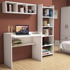 a bedroom with a bed, desk and bookshelf on the wall next to it