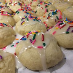 doughnuts with white icing and sprinkles on them