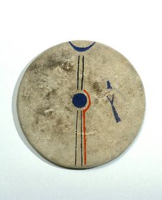 a round object with blue, red and orange lines painted on the outside of it