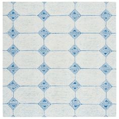 a blue and white rug with an abstract design