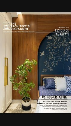 a bedroom with a bed, plant and blue wall in the corner next to it