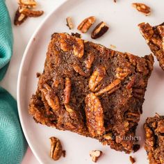 pecan crusted brownies on a white plate