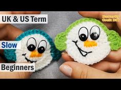 two small crocheted toys are being held in their hands with the words uk and us