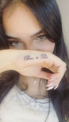 a close up of a person with a tattoo on her hand and the words, be a do