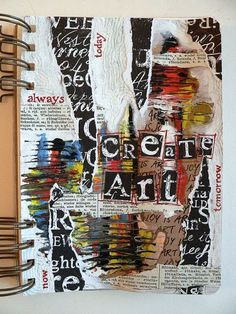 an art journal is covered with torn newspaper