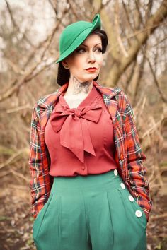 This is our well loved Classic Short fit 40’s Jacket in Red/Green Wool Plaid with a beautiful Red Slipper Satin lining. An exact replica of our original Pendleton style archive piece, loose fitting and with welt front pockets and large Bakelite style buttons… just fabulous, love it. Model is 5ft 1 and wears a Size Small ​This beautiful item is as good as it gets if you love vintage designs & totally in keeping with Authentic 1940s Style, as it is an exact reproduction of a classic 1940s item. It is made with complete integrity from the finest Rayon Crepe de Chine fabric just like the originals too.. It is nice and light, soft to the touch, hangs beautifully and easy care too... Wash by hand or in a machine on "Delicates" setting at 30 degrees A "Seamstress of Bloomsbury" Original, Simply t Red Slippers, 1940s Fashion, Green Wool, Wool Plaid, Check In, Red Plaid, Red Green