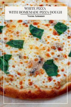 a pizza with cheese and spinach leaves on it is shown in front of a white square frame