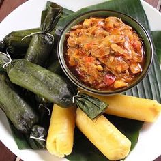 a white plate topped with food and veggies