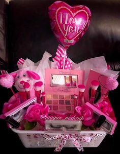 a valentine's day gift basket filled with pink items