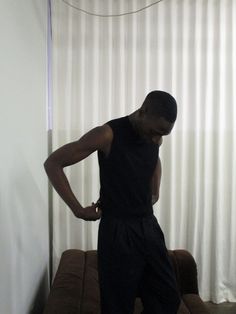 A 90's minimalist sleeveless vest constructed in a lightweight merino wool. Cut slim to the body with a crop at the waist, the result is a silhouette that is both simple and striking at the same time. Mens Spring Outfit, Mens Spring, Spring Outfit