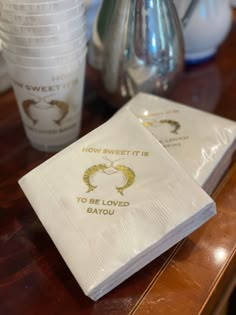 two napkins that say how sweet it is to be loved by you on top of a table