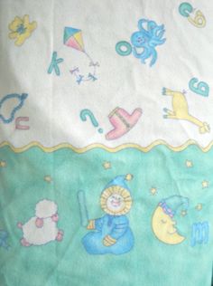 a child's bed sheet with animals and stars on it