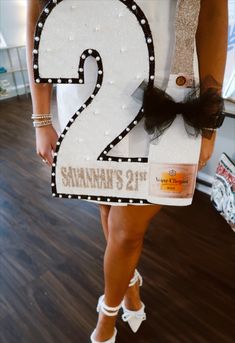 a woman wearing a costume made to look like the number two