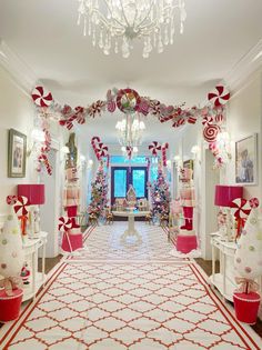 a hallway decorated with candy canes and christmas decorations