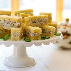 there are many pieces of food on the cake platter that is ready to be eaten