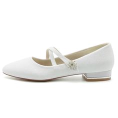 a pair of white shoes with bows on the heel