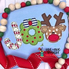 a close up of a christmas decoration on a wall with beaded decorations and beads