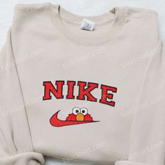 The Nike x Elmo Cartoon Embroidered Sweatshirt is a must-have for any fan of the iconic Sesame Street character. Made from premium quality materials, this sweatshirt features a vibrant and detailed embroidery of Elmo, adding a playful touch to your outfit. With its comfortable fit and cozy fabric, it is perfect for chilly days or lounging at home. The Nike Inspired Embroidered Shirt is another trendy option, showcasing a unique design that combines the classic Nike logo with intricate embroidery Nike Cartoon, Nike Inspired, Best Family Gifts, Nike Brand, Cap Men, Sports Hoodies, Hoodie Material, Nike Sweatshirts, Movie Shirts