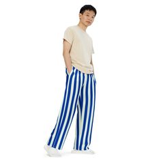 Fun blue and white stripes make these the coolest casual lounge pants. Pajamas for bedtime or just comfy wide-leg pants for kicking back around the house or hanging out and watching the basketball game. PJLove pants feature a relaxed unisex fit and can be worn comfortably on the waist or the hips. Elastic waistband with white drawstring for ultimate sizing versatility. With practical side pockets, our pjs/lounge pants are made of premium knit mid-weight (6.19 oz/yd2) jersey fabric...about the th Casual Striped Cotton Sweatpants, Casual Summer Sleepwear Trousers, Casual Wide Leg Bottoms With Vertical Stripes, Spring Loungewear Pants With Vertical Stripes, Striped Relaxed Fit Bottoms For Lounging, Wide Leg Bottoms With Contrast Stripes For Loungewear, Wide Leg Loungewear Bottoms With Contrast Stripes, Casual Wide Leg Sweatpants With Contrast Stripes, Casual Wide Leg Sleepwear