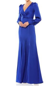 Elegant gathers fan out from the waist of this gorgeous trumpet gown that is cut from a rich satin fabric and designed with puff shoulders for added interest. 63" length Surplice V-neck Long sleeves Lined 100% polyester Spot clean Imported Formal Dance Dresses, Bishop Sleeve Dress, Gown Designs, Trumpet Gown, Prussian Blue, Long Sleeve Gown, Designer Prom Dresses, Prom Designs, Mac Duggal